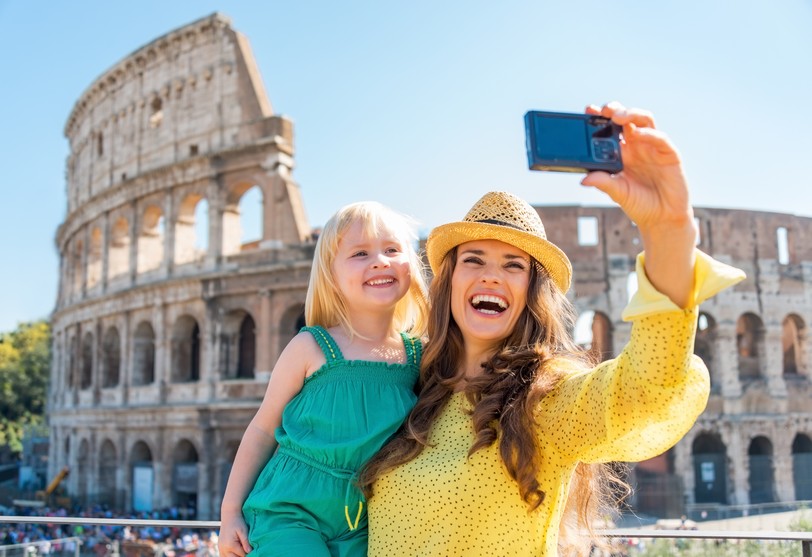 Happy mother and baby girl in front of colosseum in rome, Italy shutterstock_253301299.JPG