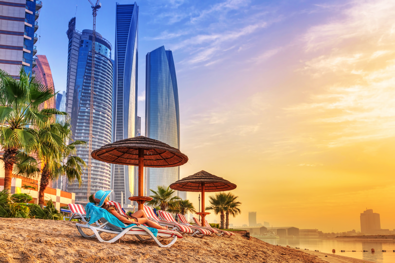 Dubai Sun holidays on the beach of Persian Gulf at sunrise shutterstock_227555356.jpg
